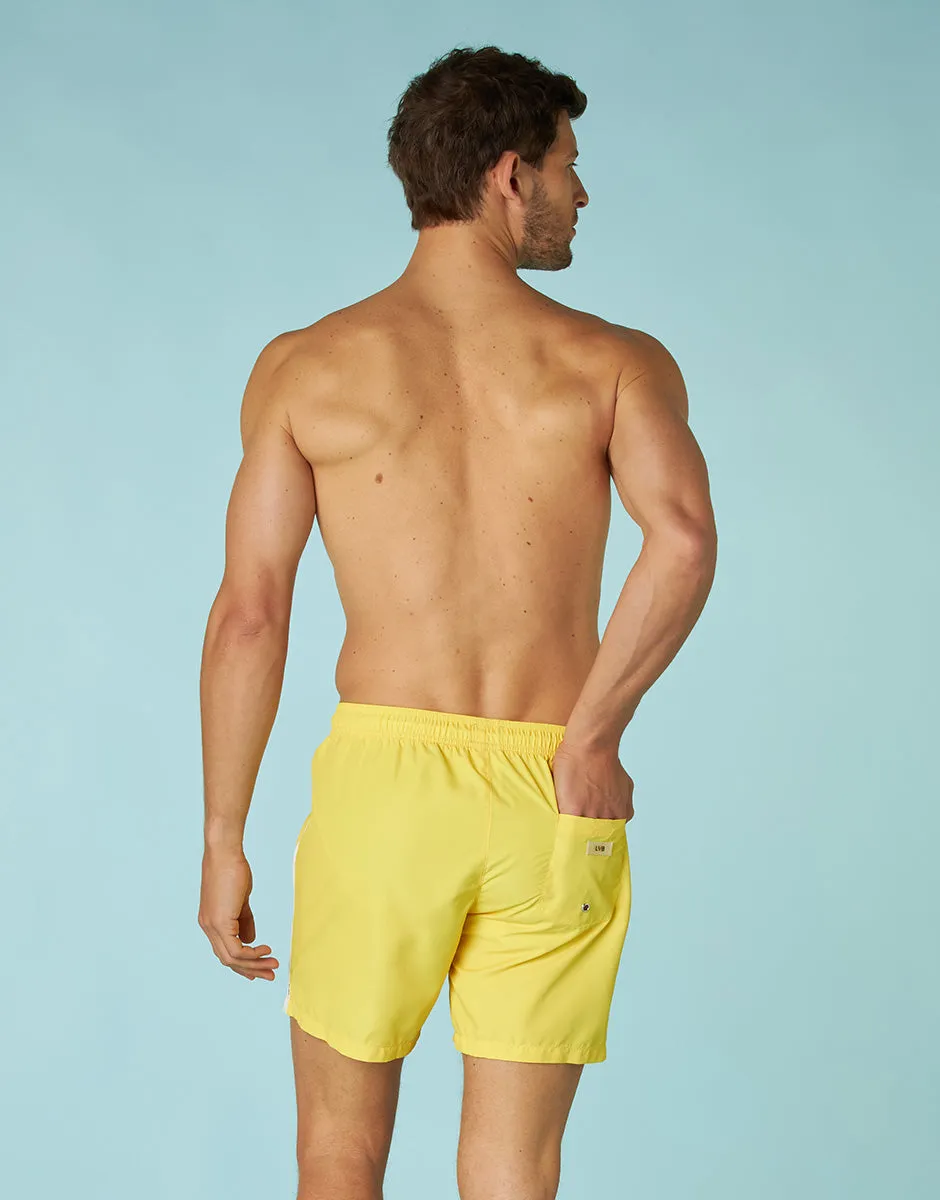 Pastel yellow swim trunks for men